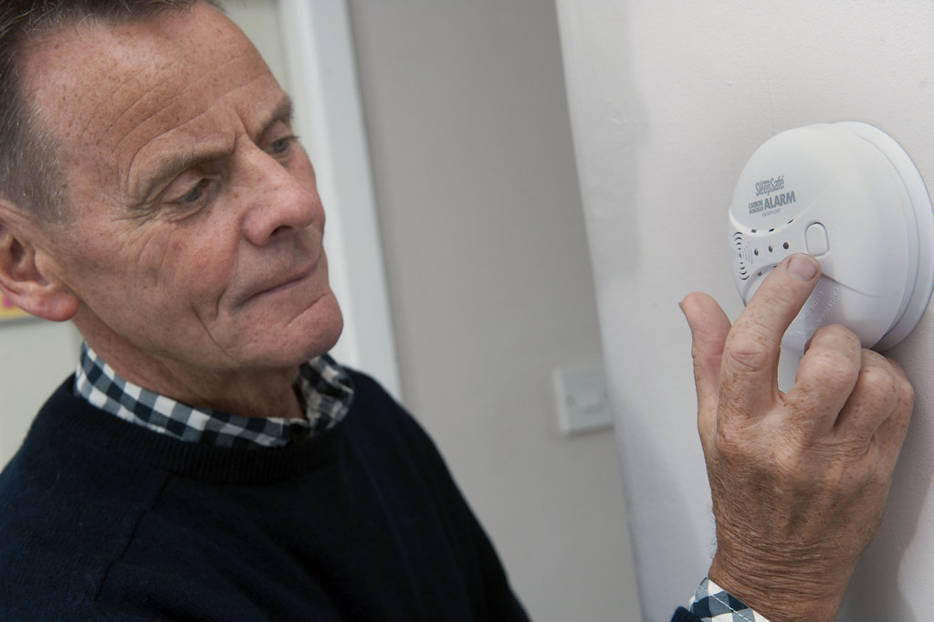 Illustration of smoke and carbon monoxide sensors installed in a home. These sensors conduct safety checks, detecting the presence of smoke and harmful gases to protect occupants from potential hazards.